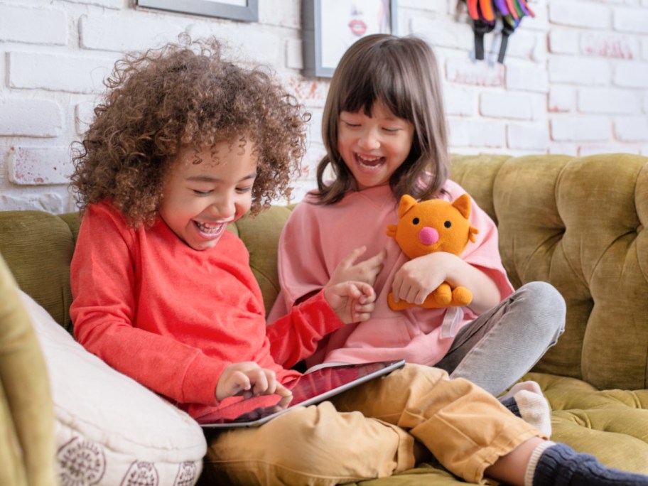 children paying on a tablet