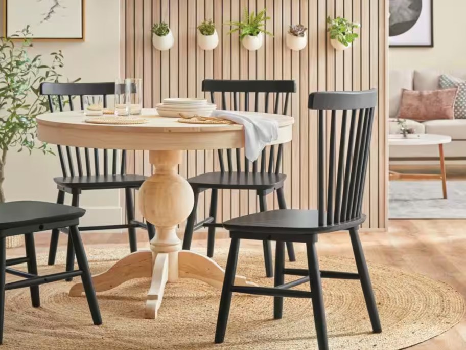 natural round wooden table in dining room
