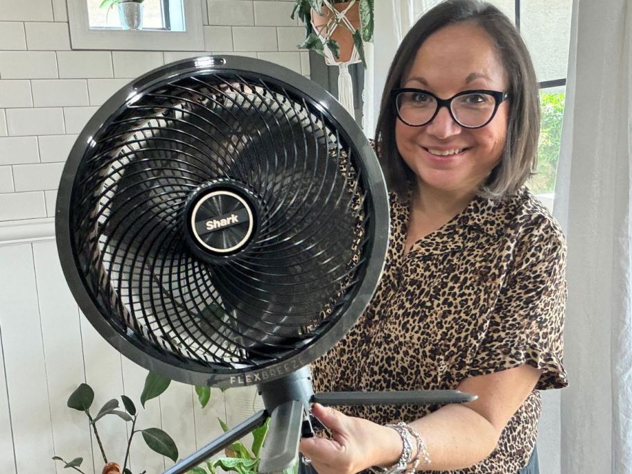 woman holding up a Shark Flex Fan