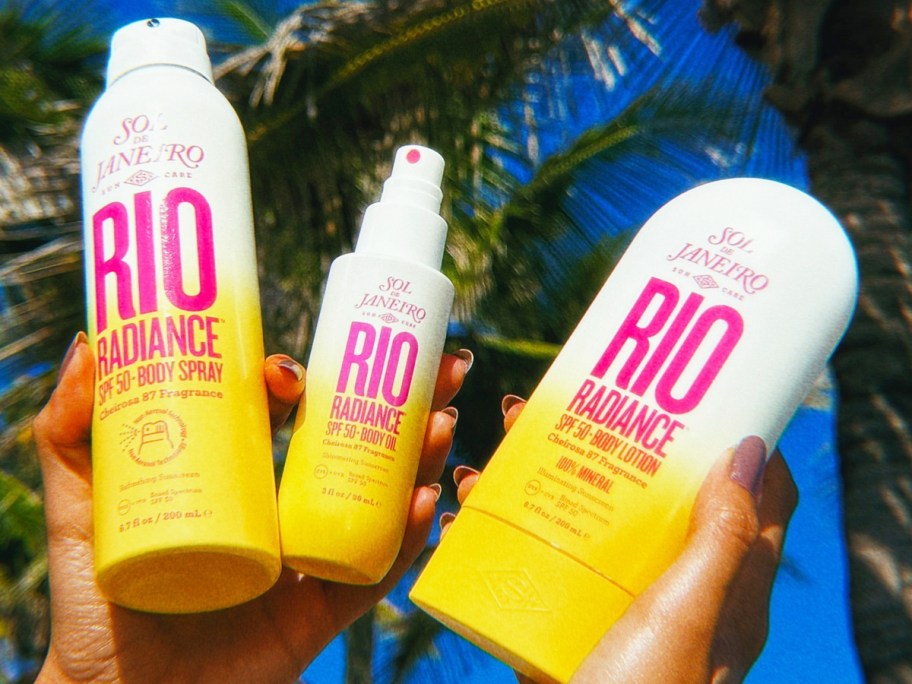 two hands holding up three Sol De Janeiro Rio Radiance sunscreen products