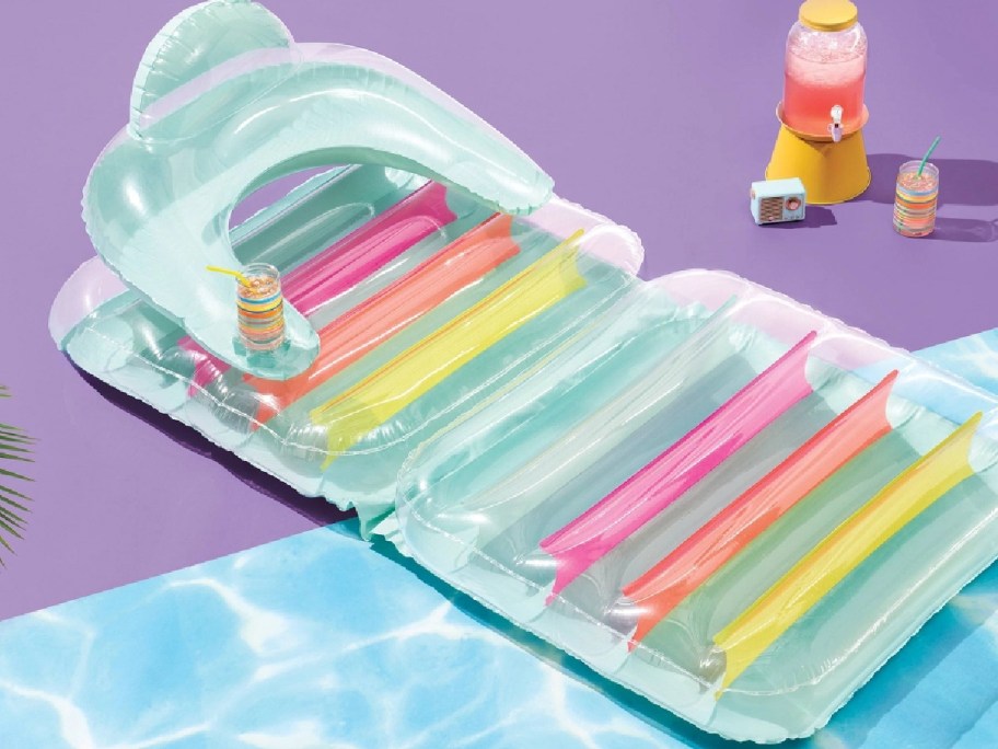 colorful pool lounge displayed on a purple and blue layout