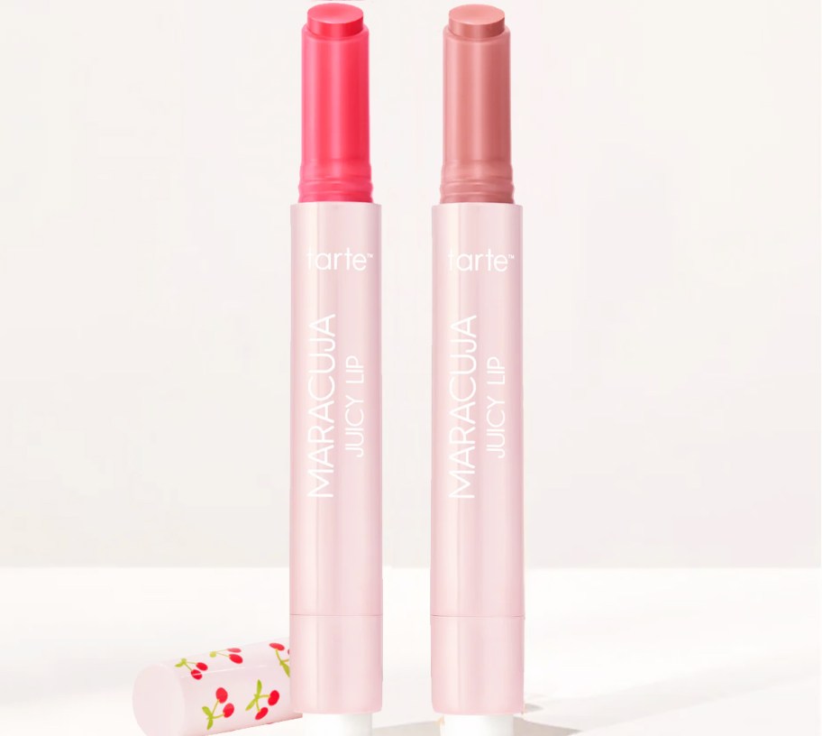two tarte Maracuja Juicy Lip Balm Glosses with lids off