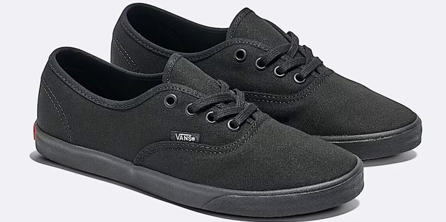 pair of all black vans sneakers