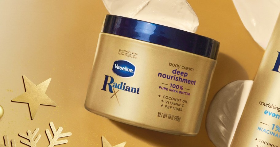 gold jar of Vaseline Radiant X Body Cream on a gold background
