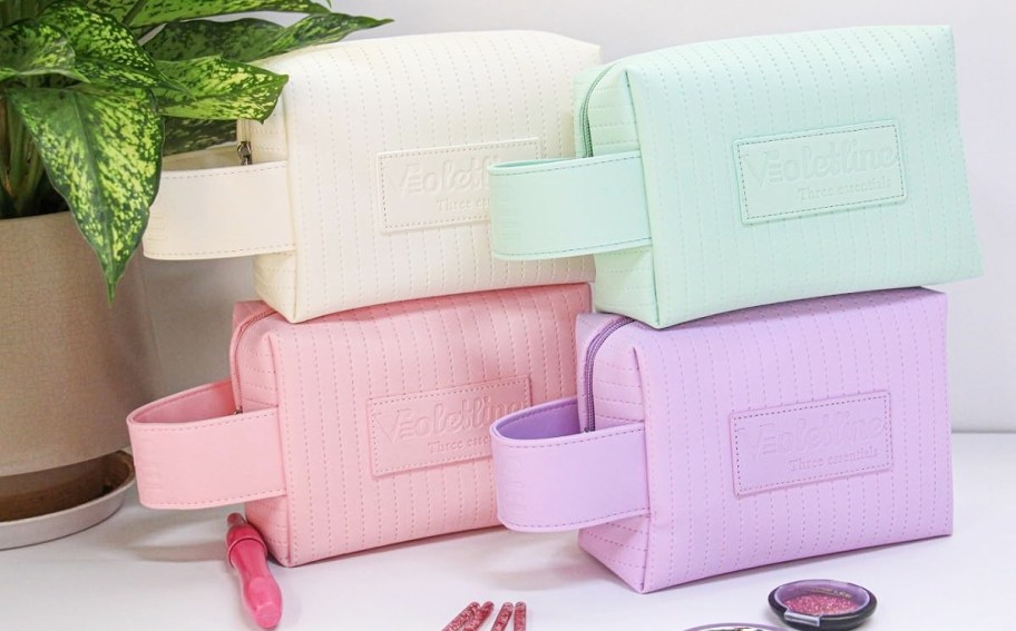 stack of cosmetic bags in various colors