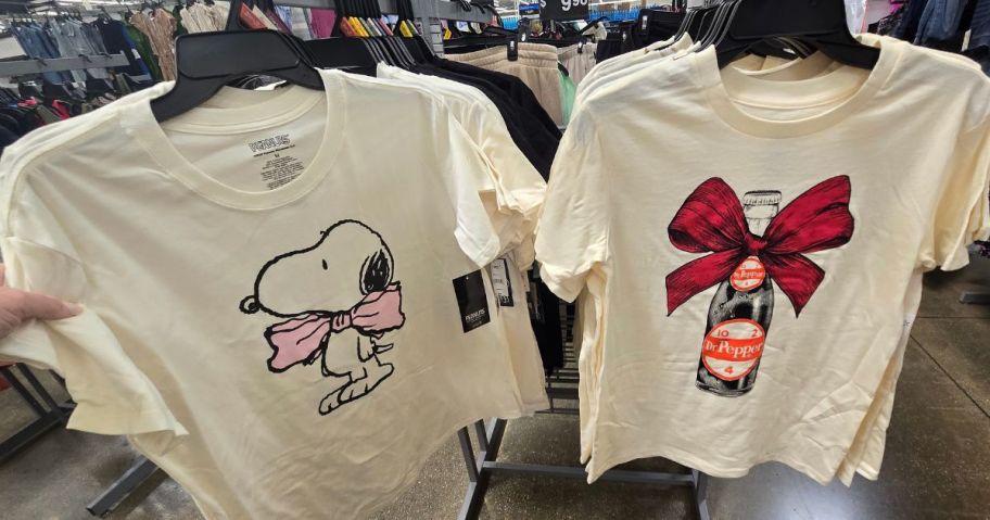 Two walmart graphic tees for women with snoopy and dr. pepper on them