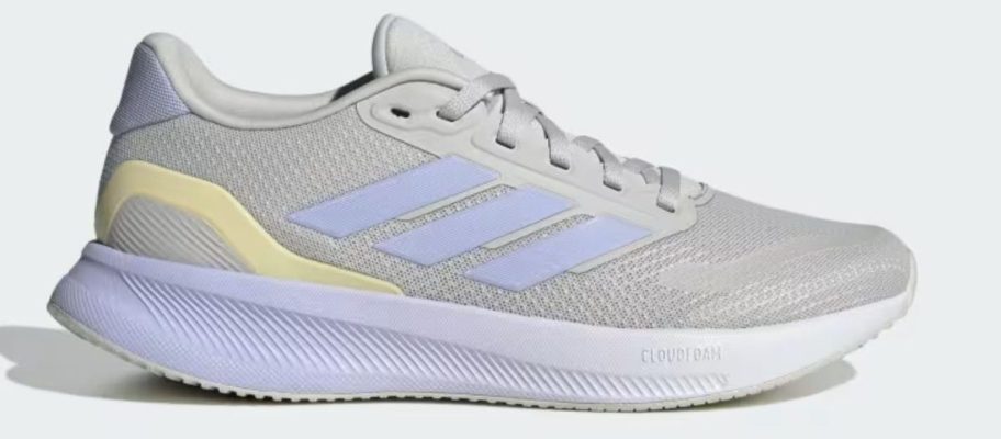 blue, yellow, and grey adidas Women's RunFalcon 5 Running Shoe stock image