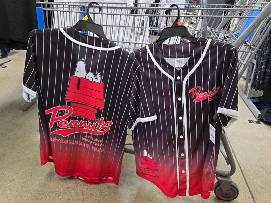 Peanuts Men's Snoopy Graphic Baseball Jerseys hanging on cart in store