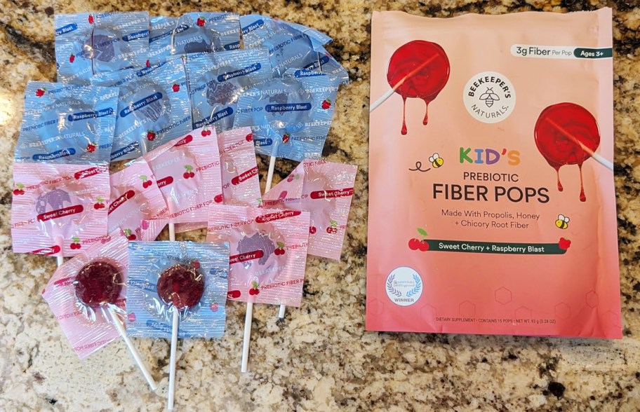 beekeeper's naturals fiber lollipops on a counter with package