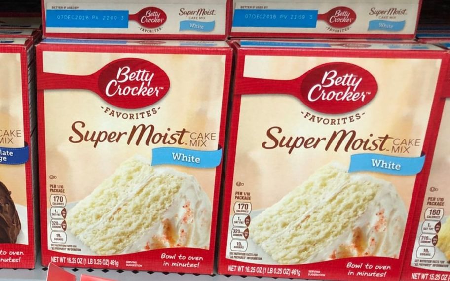 two boxes of betty crocker cake mix on a store shelf