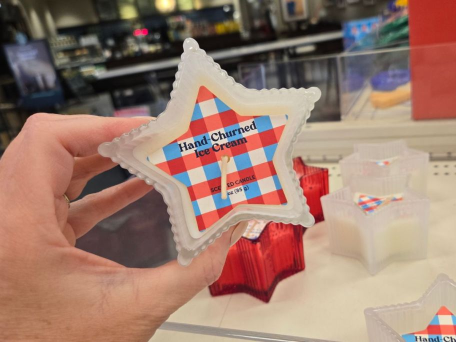 Hand-Churned Ice Cream Star Candle in hand in store