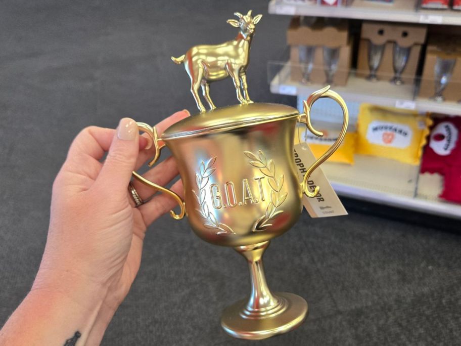 Goat Trophy in hand in store