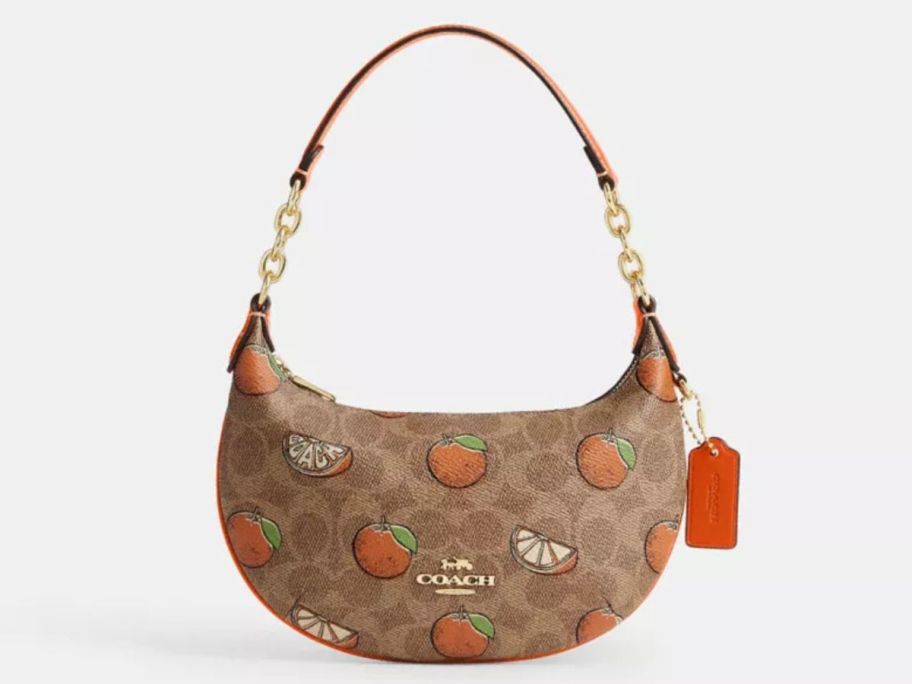 brown and orange Coach Mini Payton Bag