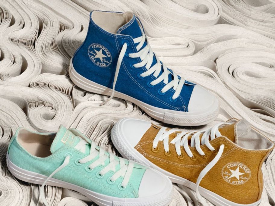 blue, yellow, and green converse shoes