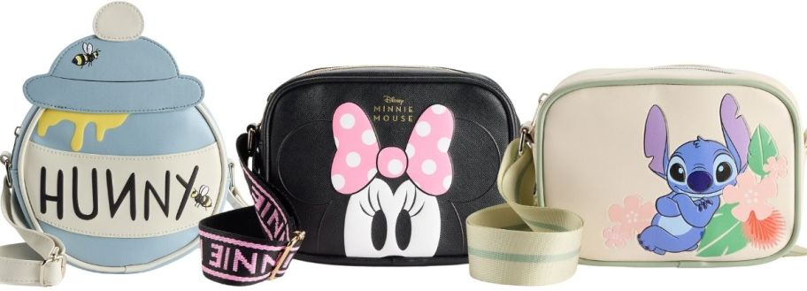 3 disney crossbody bags, with one shaped like a honey pot and the the other two in a camer bag design