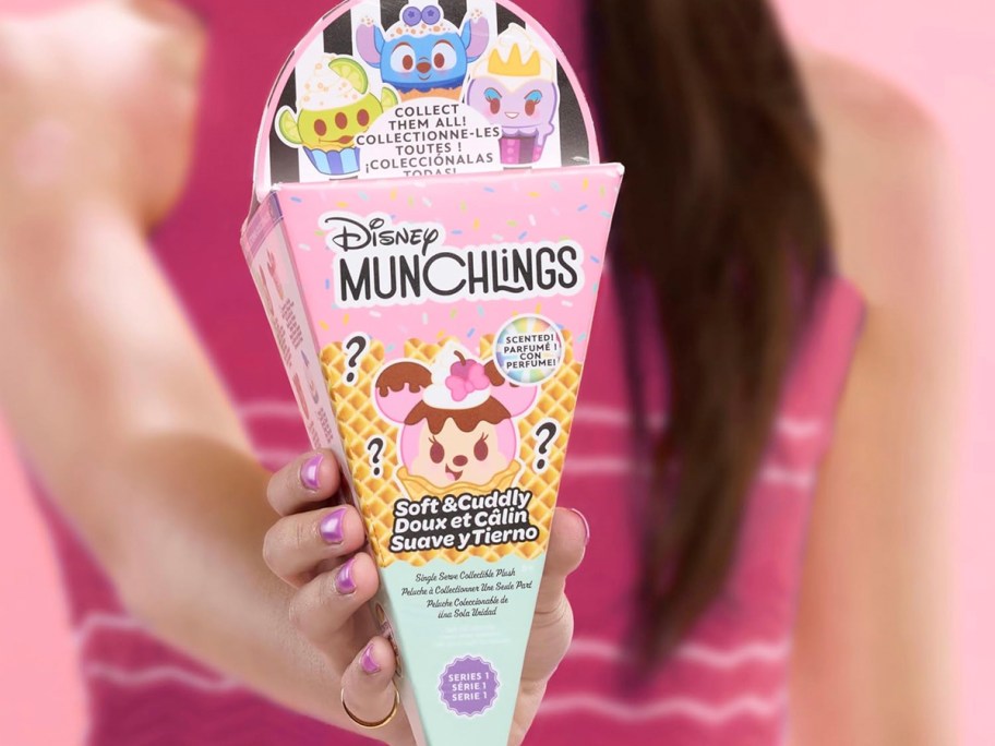 hand holding disney munchlings single serve box 