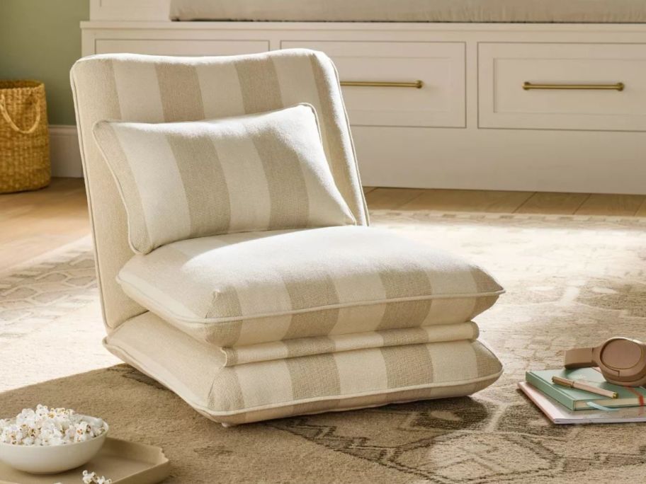 beige and white striped Threshold designed w/ Studio McGee Teen Floor Lounge Chair on floor in living room