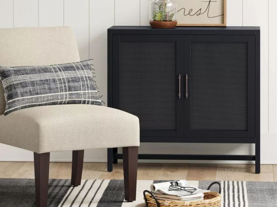 black Threshold Warwick 2-Door Cabinet against wall in living room
