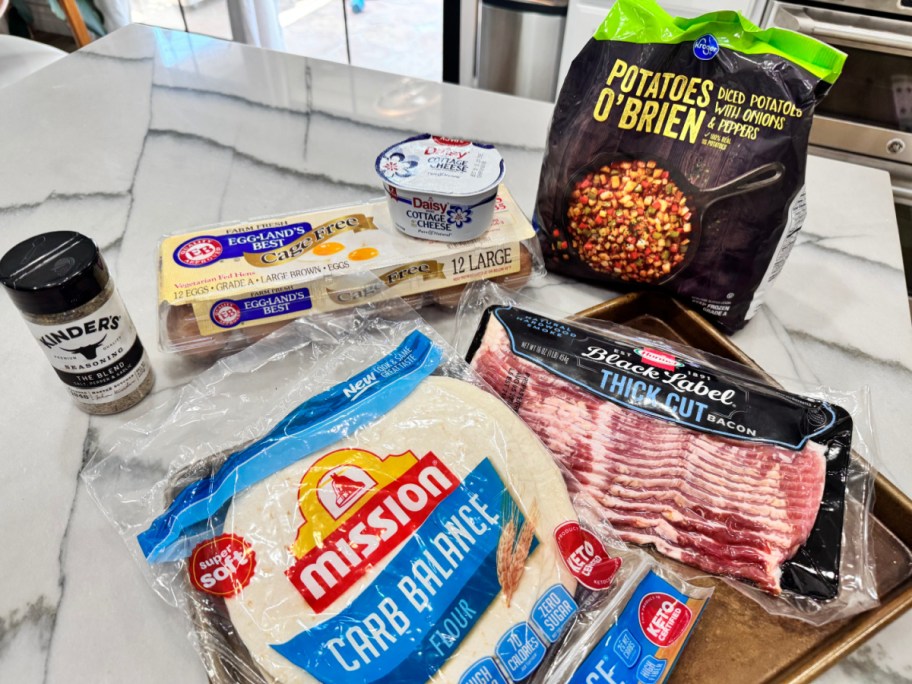 ingredients on the counter to make breakfast burritos 