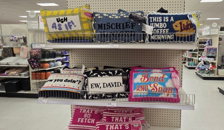 target movie and tv themed throw pillows on an aisle endcap