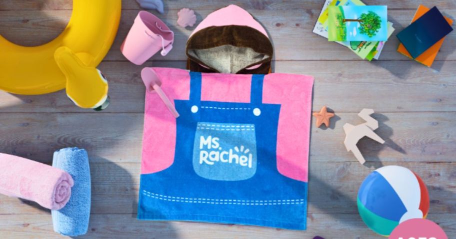 ms rachel kids hooded towel on desk with beach toys around it