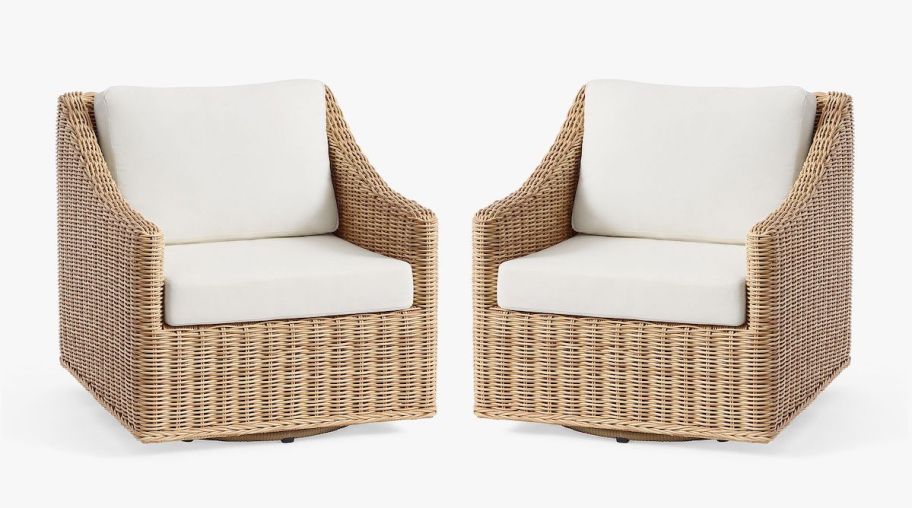 stock photo of wicker swivel chairs with white cushions