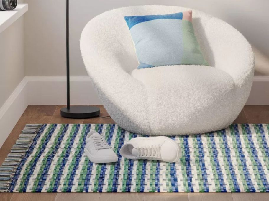 green and blue Handwoven Area Rug on floor in living room
