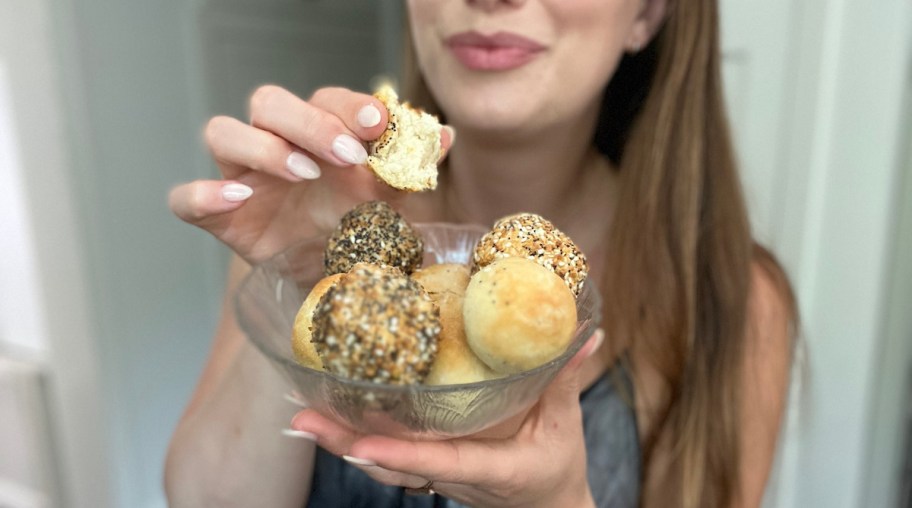 hand holding bagel bite