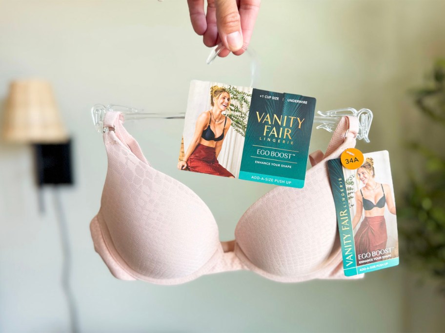 hand holding pink vanity fair bra 