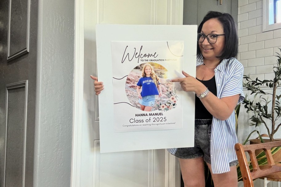 woman holding up a poster