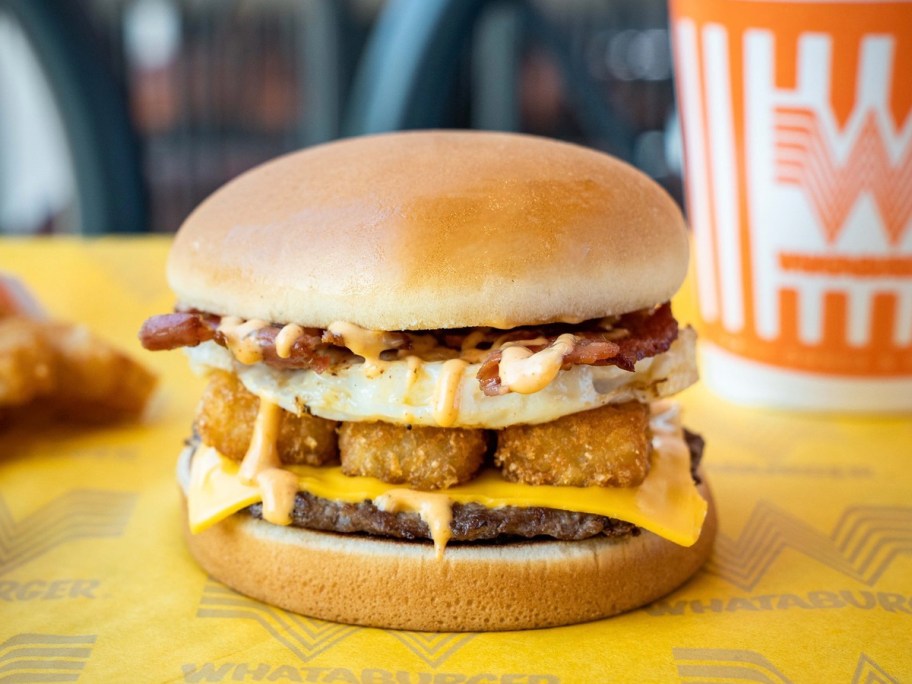 breakfast burger with drink on table