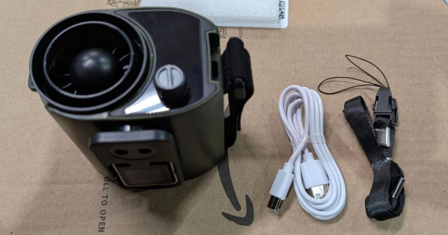 A portable waist fan with attachments on a box 