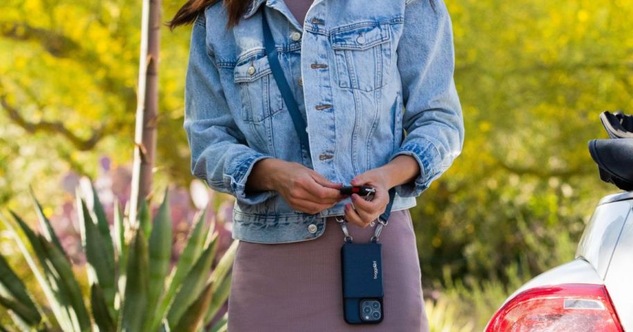 Woman wearing a Baggallini On The Go iPhone Card Case Crossbody