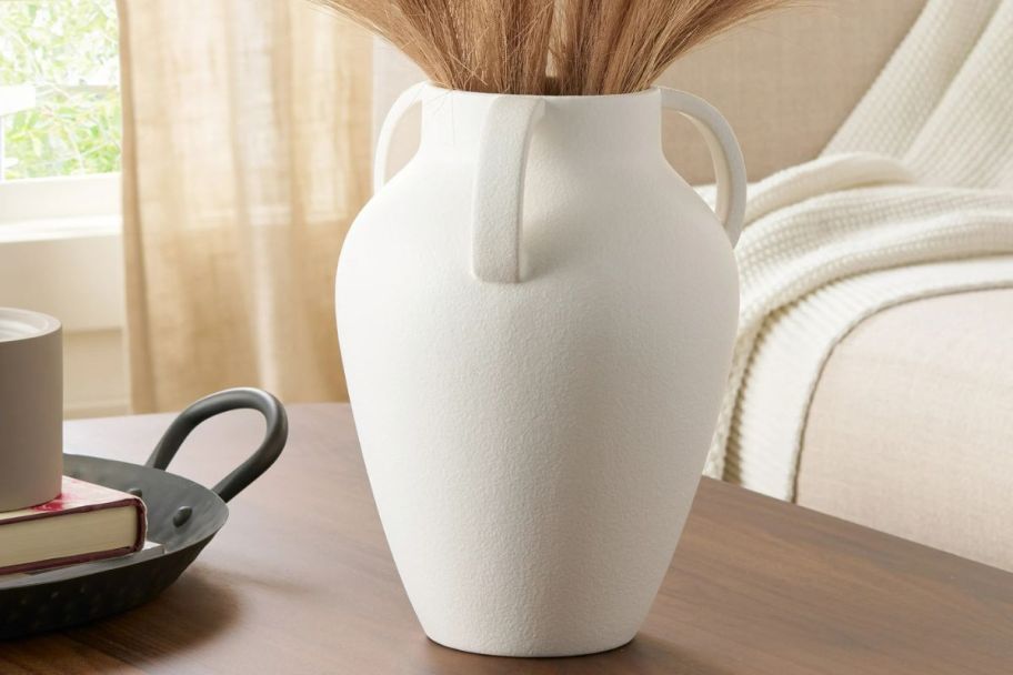 A white vase on a table