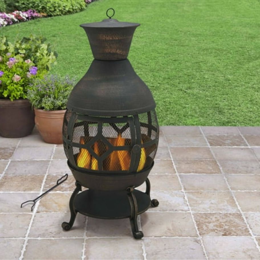A black chiminea on a patio