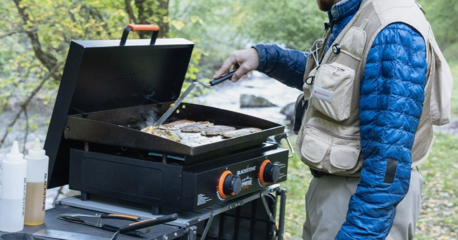 man using a Blackstone Adventure Ready griddle