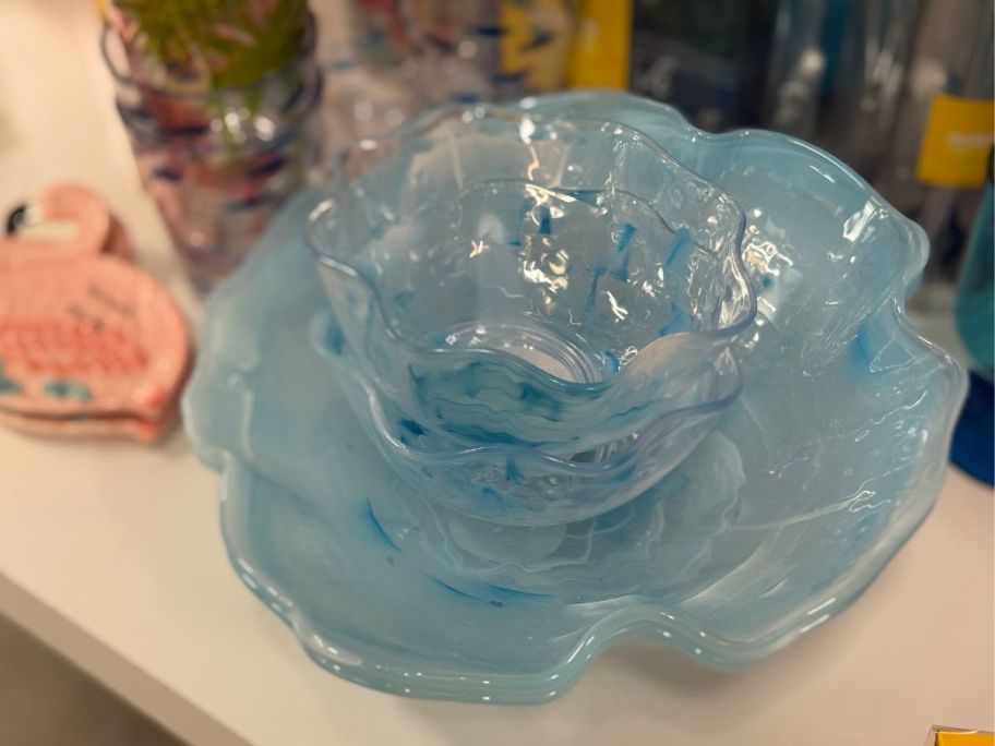 several ice-blue bowls and plates