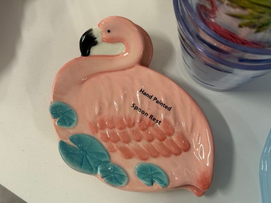 A spoon holder shaped like a flamingo 