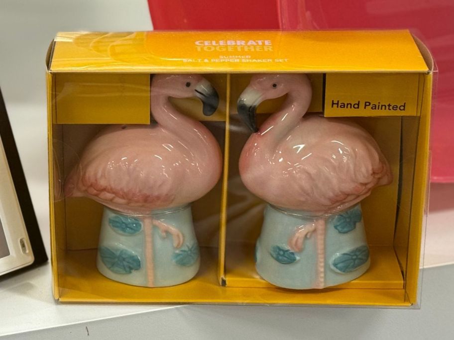 Two porcelain flamingos in a box