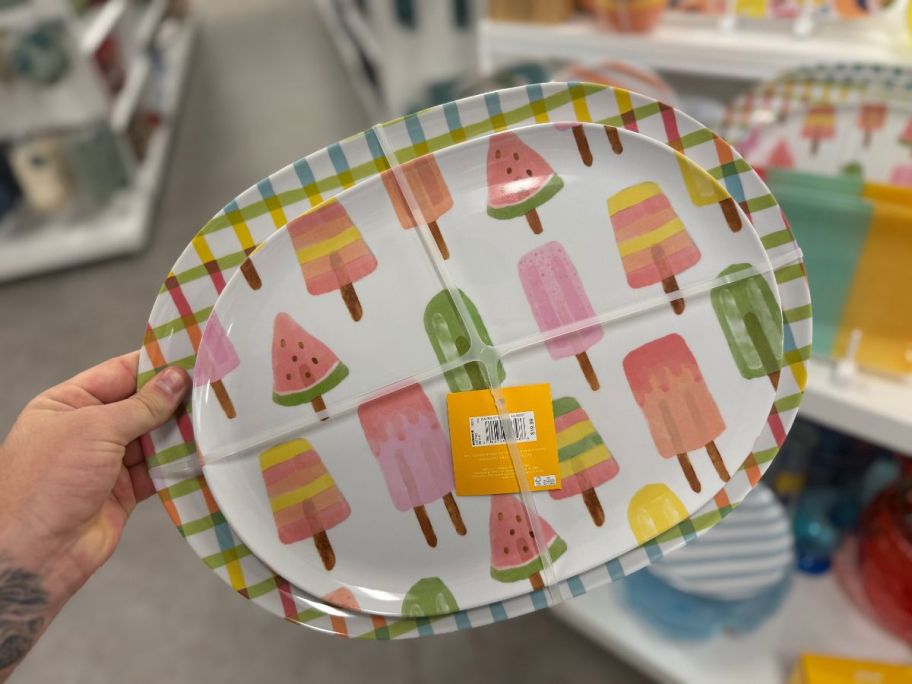 A large serving platter with ice pops on it 