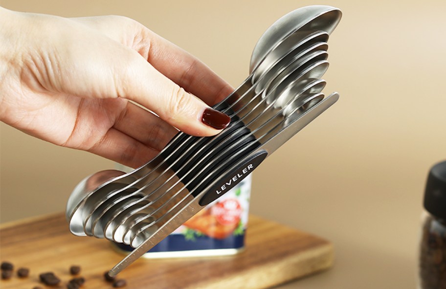 hand holding a magnetic measuring spoons set