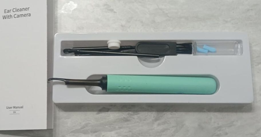 An Ear Cleaner in Green on a table