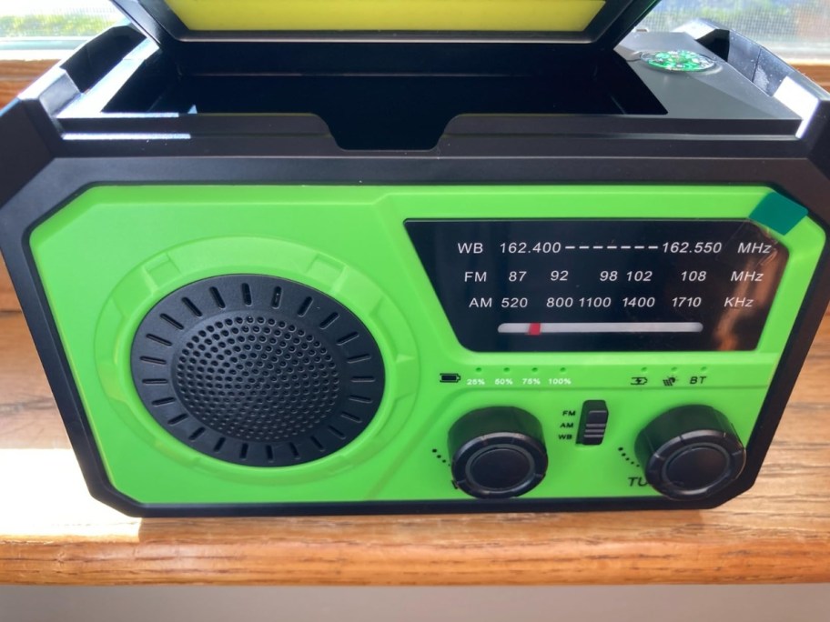 emergency weather radio in green sitting on tabletop 