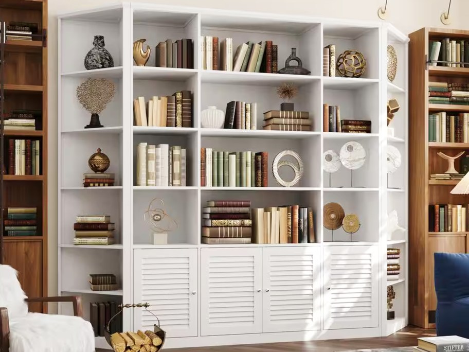 large white bookcase with books and decor on each shelf