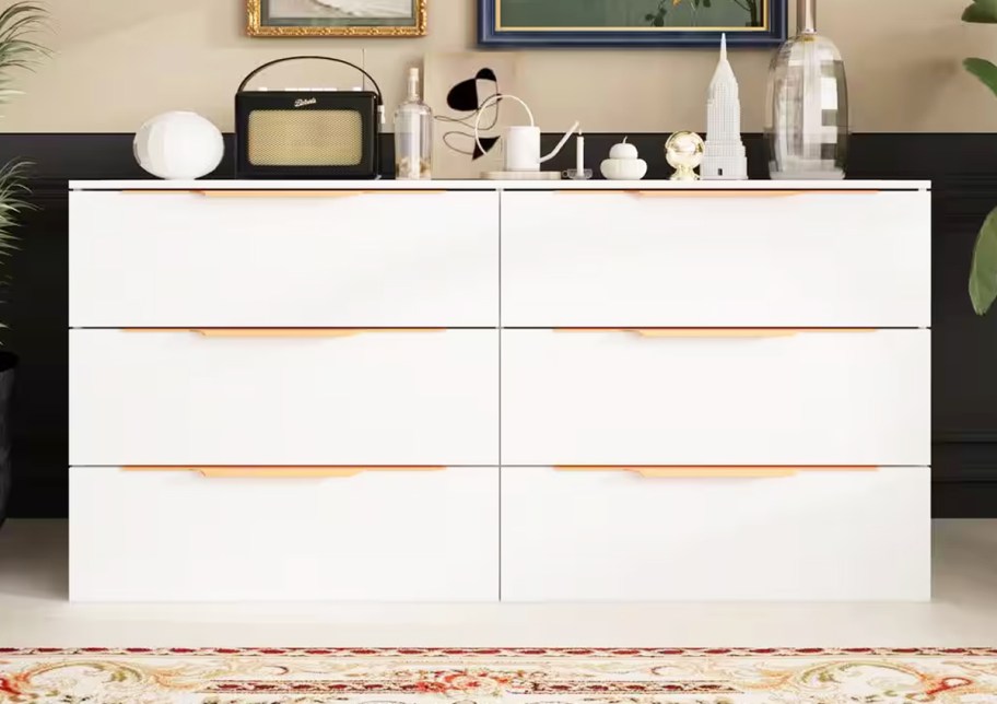 white 6-drawer dresser with decor on top