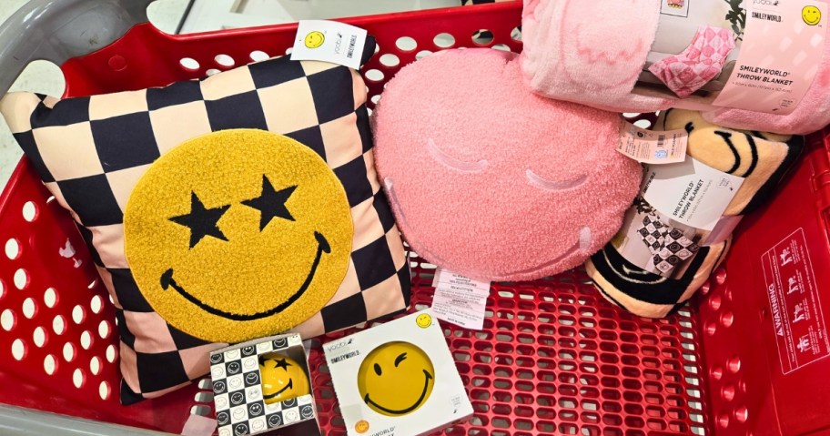 a Target cart filled with smiley face pillows, blankets, and decor