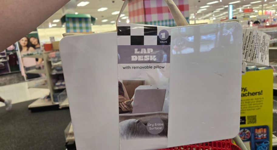 hand holding lap desk in top of target cart