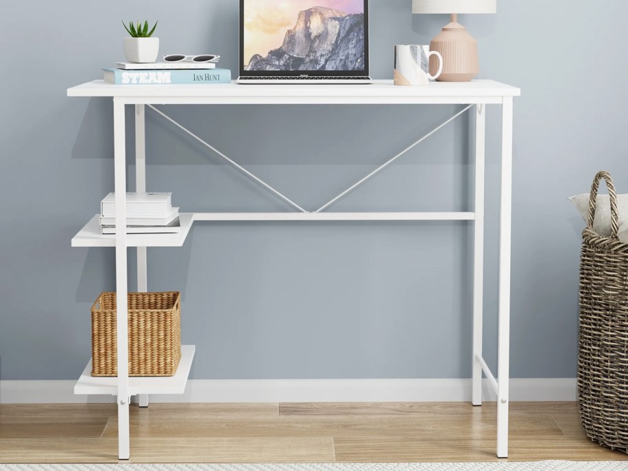 thin white desk with storage shelves on the side