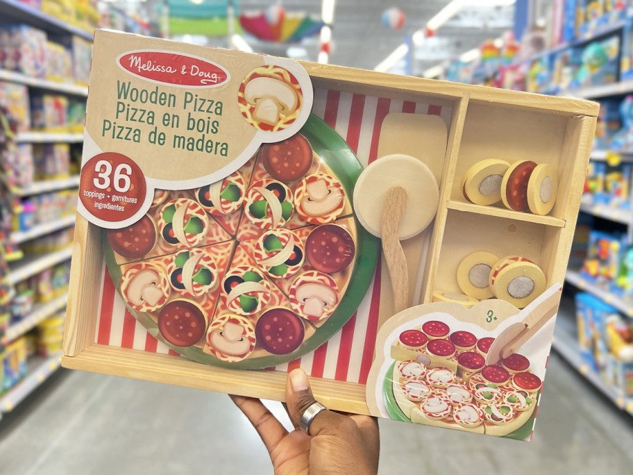 hand holding up Melissa & Doug Pizza Party Play Set in store