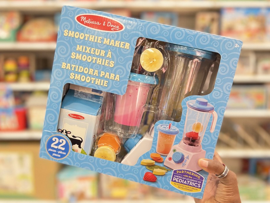 hand holding up Melissa & Doug Smoothie Maker set in store
